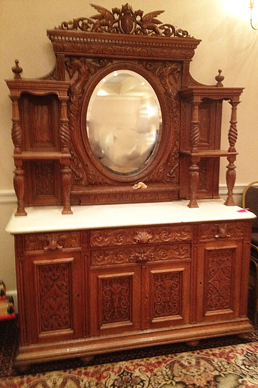 Beautifully and heavily carved oak marble-top sideboard attributed to R.J. Horner. Tim’s Inc. image.